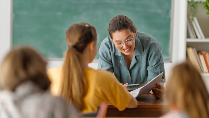 A teacher shares an NZQA brochure with her students