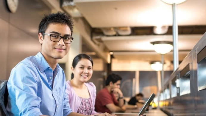 Two students smiling