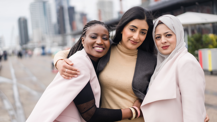 Three women posing for a picture