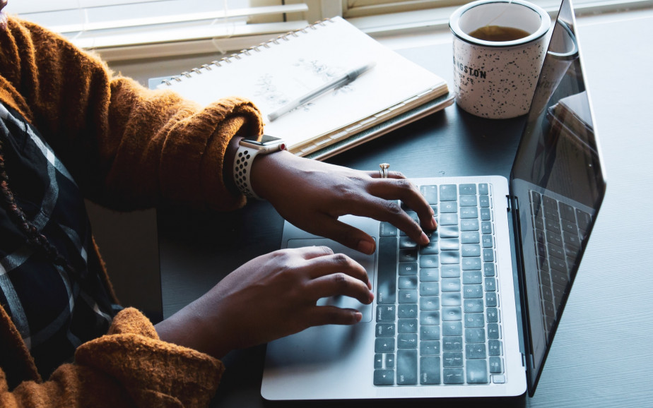 Woman typing on laptop