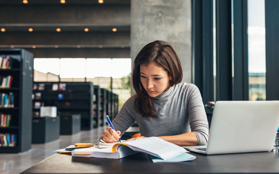 Woman studying in a library