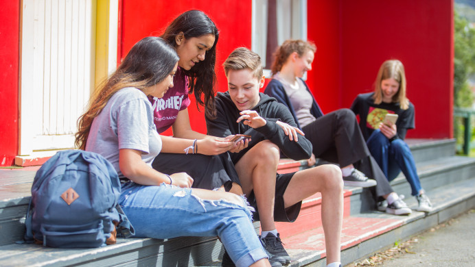 Students at a high school relax over lunch