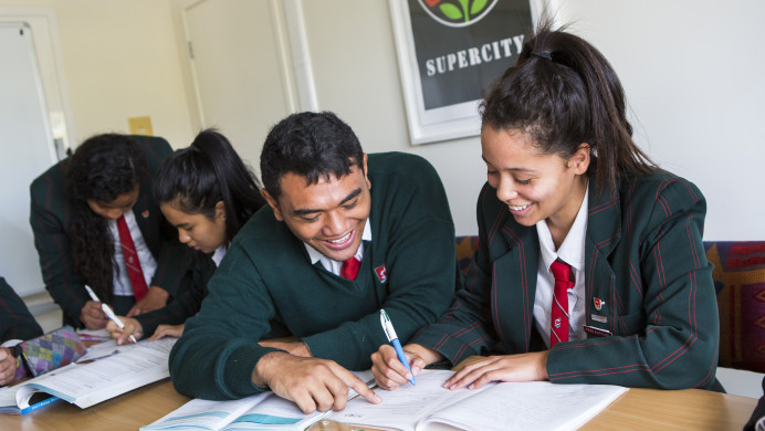 Two students from Onehunga college are studying at a desk