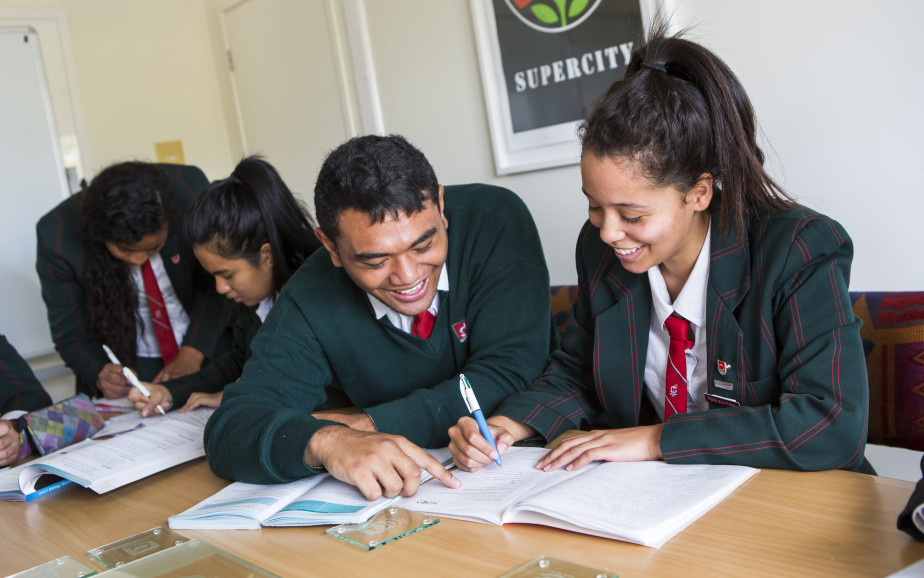 Two students from Onehunga college are studying at a desk