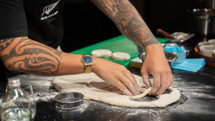 A students preps bread as part of their tertiary training