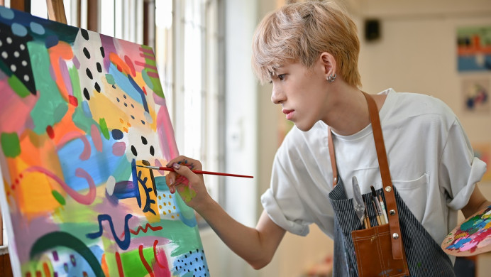 Artist painting on a canvas