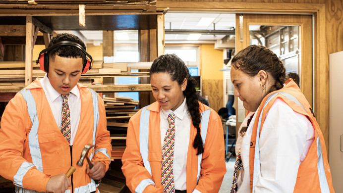 Three secondary students take part in a hard tech class